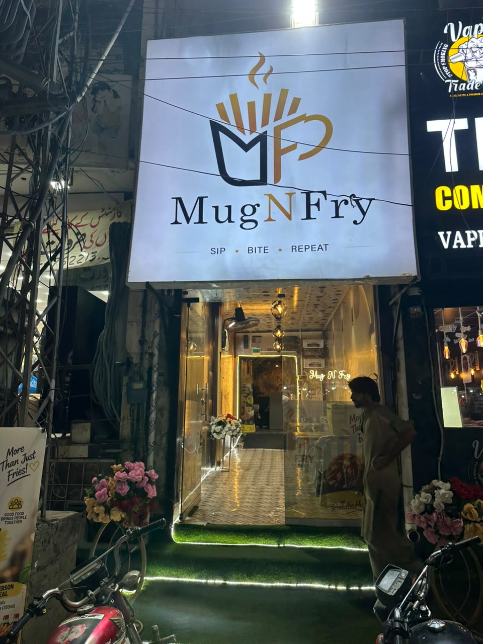MugNfry storefront at night — Barkat Chowk, Township